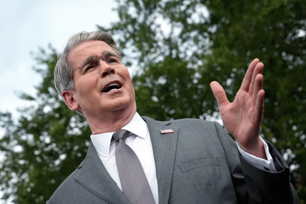 Treasury Secretary Scott Bessent gestures while speaking outdoors