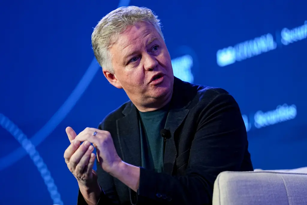 Cloudflare CEO Matthew Prince gestures while speaking on stage