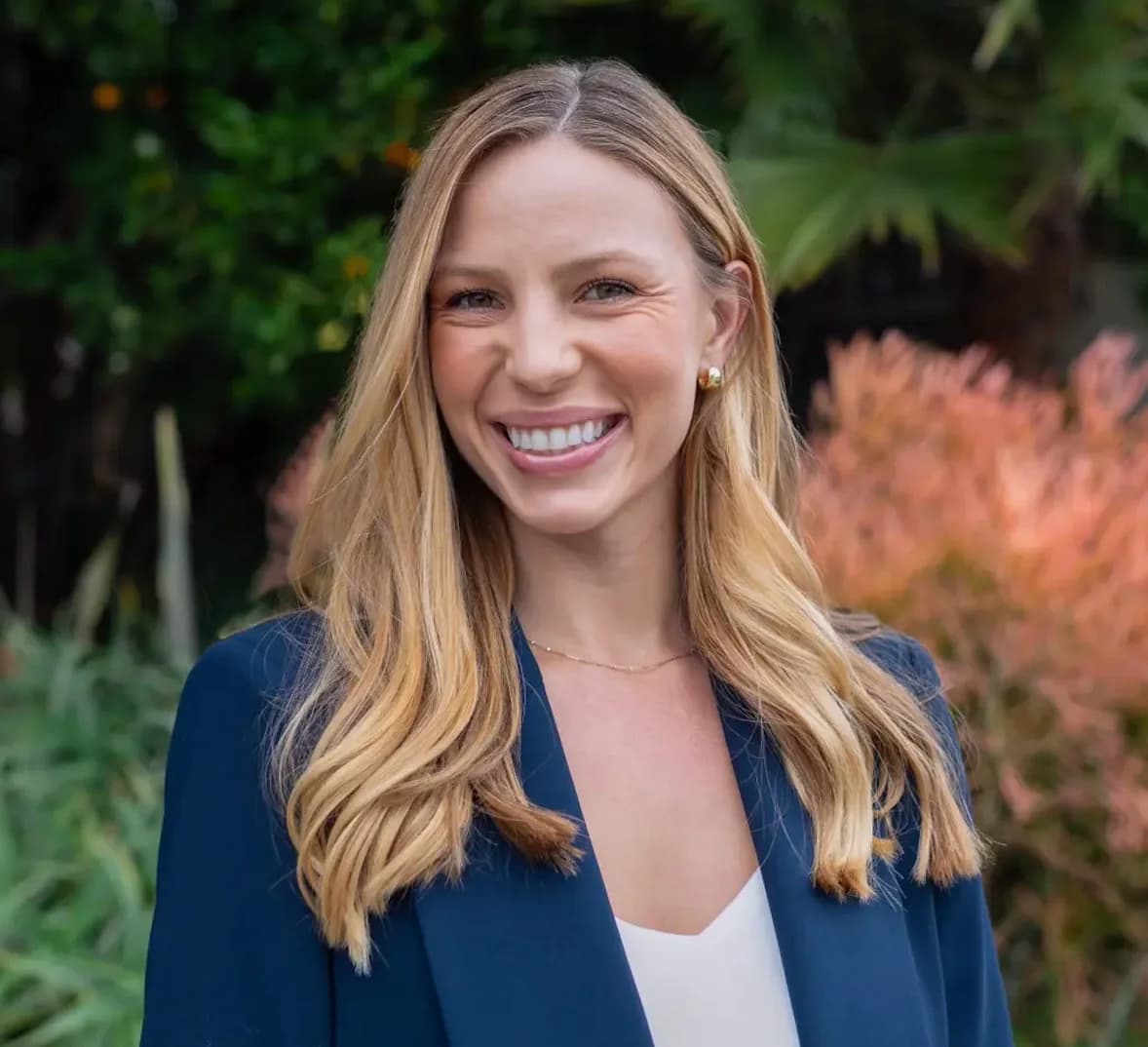 Portrait of a Deloitte report author smiling outdoors