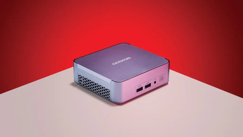 A compact mini PC used for on premise AI infrastructure sits on a desk