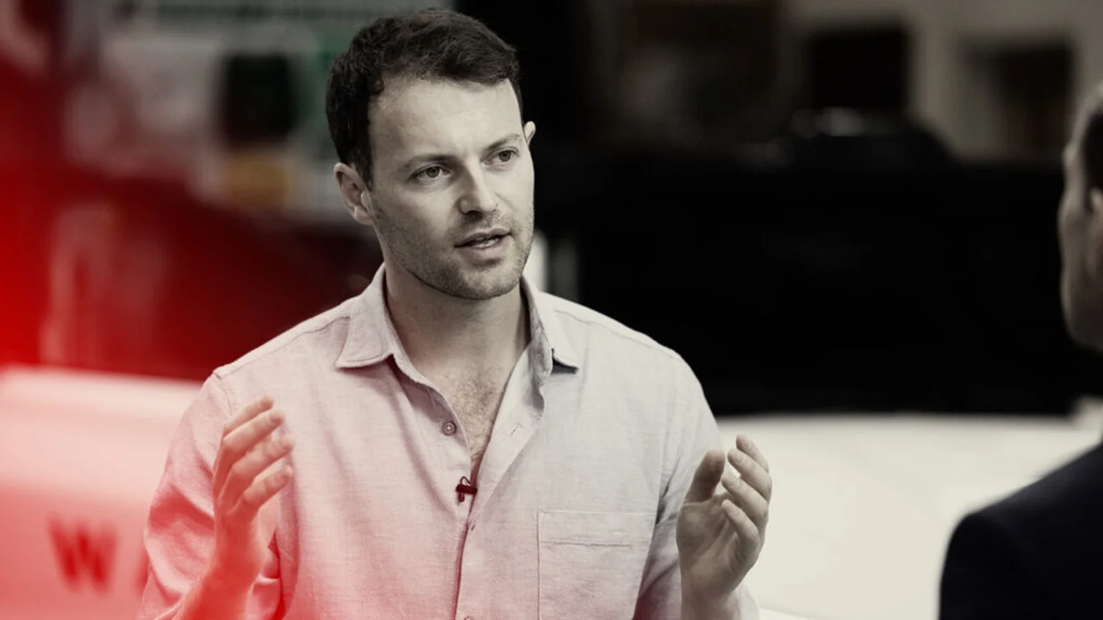 Alex Kendall, co-founder and chief executive of Wayve, gestures with both hands while speaking during an interview