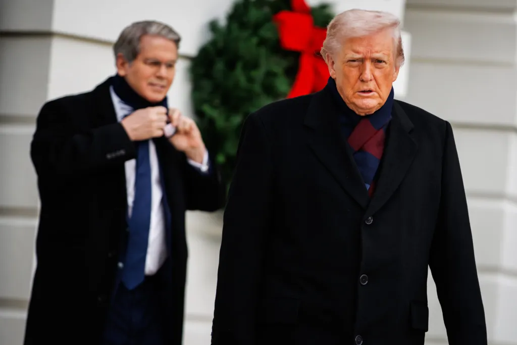 President Donald Trump walks outside the White House with Treasury Secretary Scott Bessent behind him